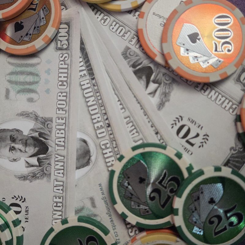 Casino chips and fun money notes used in place of real cash at a fun casino